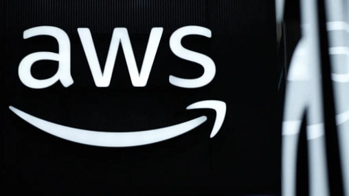 AWS logo glowing in white on a dark background, with blurred vertical light reflections visible to the right